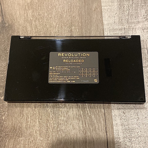 Eyeshadow pallet with golds, pinks, nudes, and browns. - Picture 3 of 4